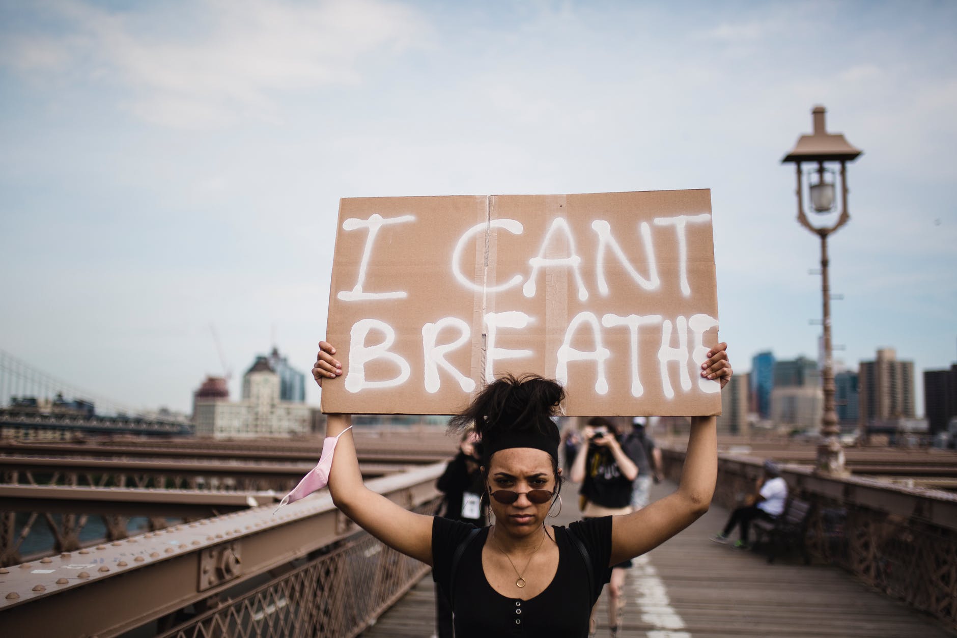 woman holding a sign in protest