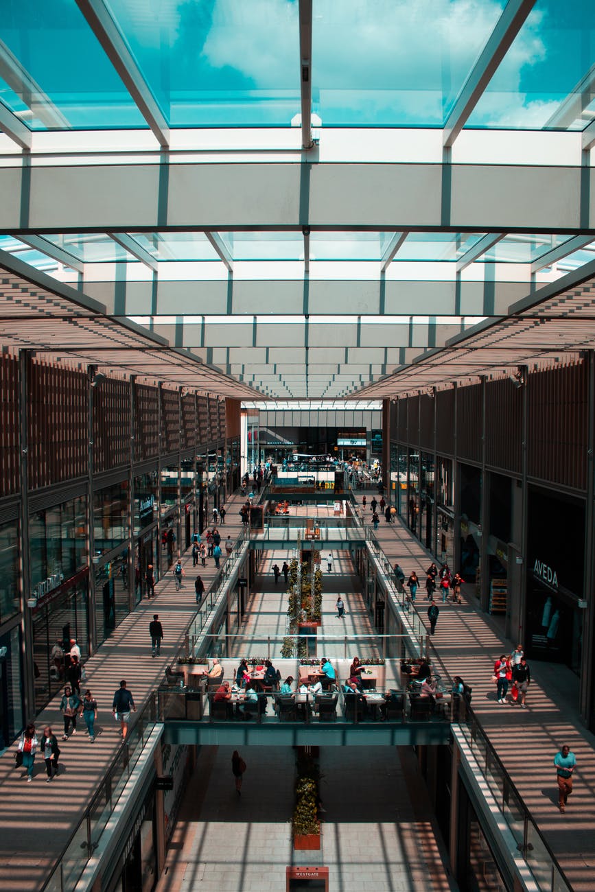 group of people walking inside building